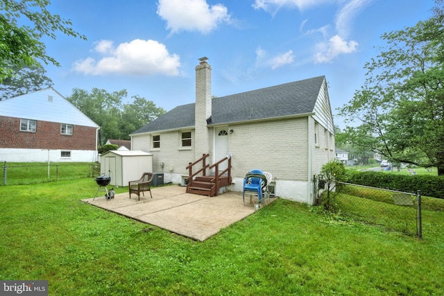 2816 Denley Pl, Silver Spring, MD 20906 - back of house featuring brick siding, a storage shed, a chimney, a patio area, and roof with shingles