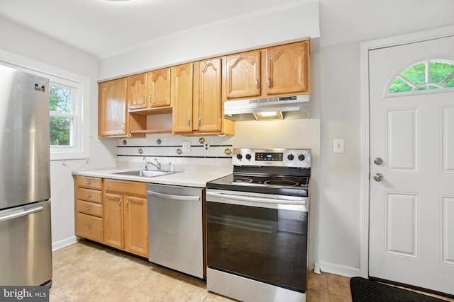 2816 Denley Pl, Silver Spring, MD 20906 - kitchen featuring appliances with stainless steel finishes, under cabinet range hood, plenty of natural light, and light countertops