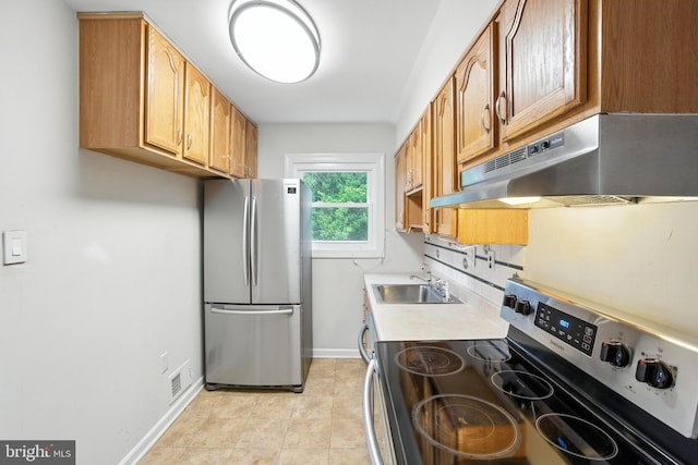 2816 Denley Pl, Silver Spring, MD 20906 - kitchen with appliances with stainless steel finishes, under cabinet range hood, light countertops, brown cabinetry, and light tile patterned floors