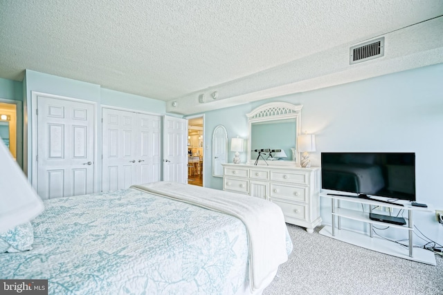 604 Dover House Rd Unit 604S, Bethany Beach, DE 19930 - bedroom with a textured ceiling, carpet, and a closet