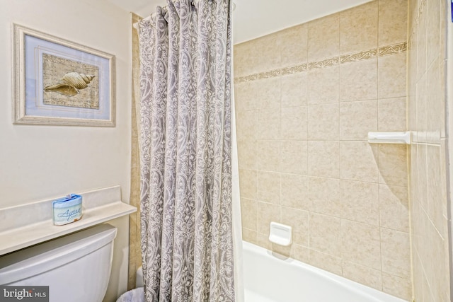 604 Dover House Rd Unit 604S, Bethany Beach, DE 19930 - bathroom with shower / bath combo with shower curtain and toilet