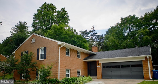 5116 Portsmouth Rd, Fairfax, VA 22032 - view of front of property featuring an attached garage, brick siding, concrete driveway, and a chimney