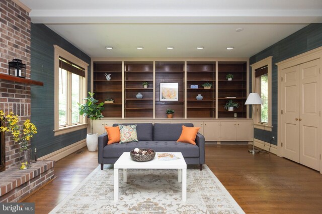 403 Club Rd, Baltimore, MD 21210 - living area featuring wood finished floors, baseboards, recessed lighting, a brick fireplace, and beam ceiling