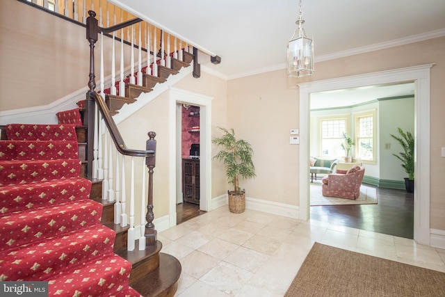 403 Club Rd, Baltimore, MD 21210 - staircase featuring a chandelier, ornamental molding, tile patterned floors, and baseboards