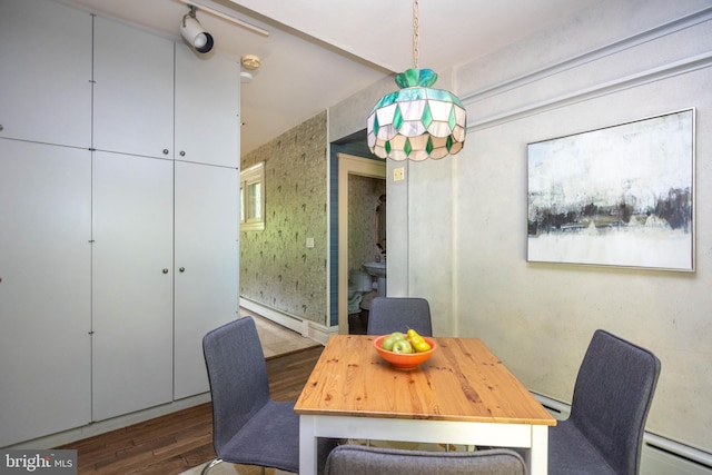 403 Club Rd, Baltimore, MD 21210 - dining space featuring wood finished floors, a baseboard radiator, and baseboard heating