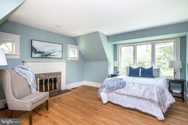 403 Club Rd, Baltimore, MD 21210 - bedroom with baseboards, multiple windows, wood finished floors, and vaulted ceiling