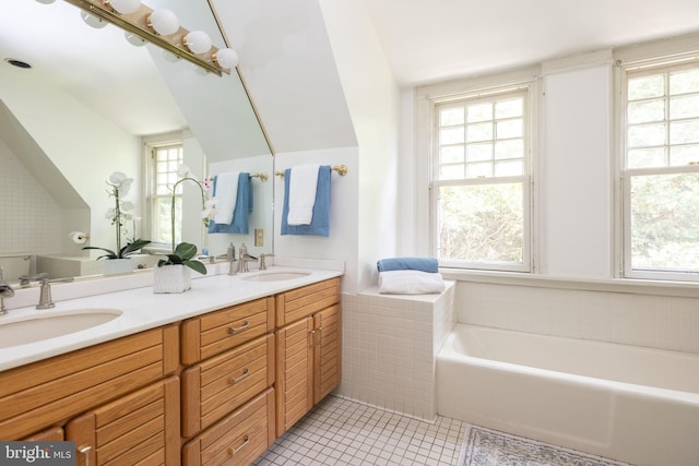 403 Club Rd, Baltimore, MD 21210 - full bathroom featuring double vanity, a bath, tile patterned flooring, plenty of natural light, and lofted ceiling