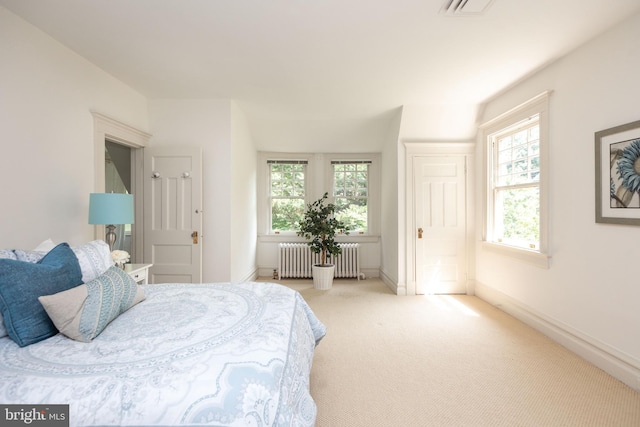 403 Club Rd, Baltimore, MD 21210 - bedroom with radiator, light colored carpet, and baseboards