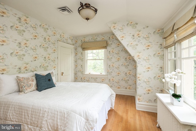 403 Club Rd, Baltimore, MD 21210 - bedroom featuring light wood-type flooring, multiple windows, baseboards, and wallpapered walls
