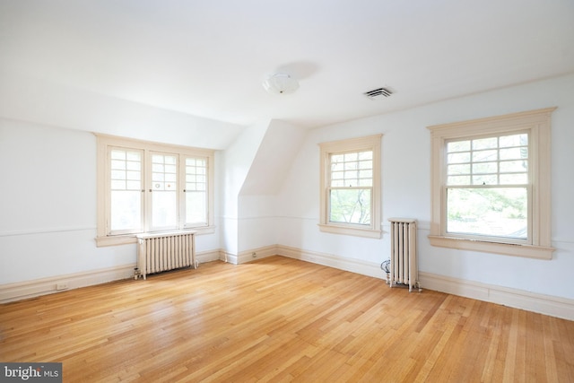 403 Club Rd, Baltimore, MD 21210 - additional living space featuring radiator heating unit, light wood-style floors, and baseboards