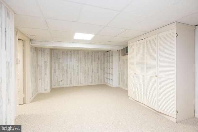 403 Club Rd, Baltimore, MD 21210 - finished basement featuring a paneled ceiling, carpet floors, baseboards, and wood walls