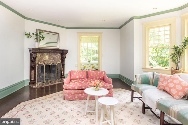 403 Club Rd, Baltimore, MD 21210 - living area featuring plenty of natural light, ornamental molding, a premium fireplace, baseboards, and wood finished floors