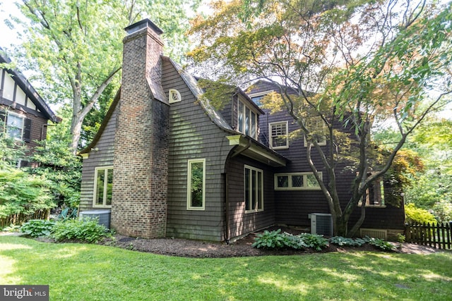 403 Club Rd, Baltimore, MD 21210 - view of property exterior featuring a chimney and central air condition unit