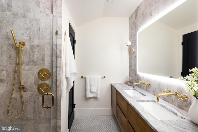 441 Q St NW Unit 2, Washington, DC 20001 - full bathroom with a shower stall, double vanity, lofted ceiling, and tile patterned flooring