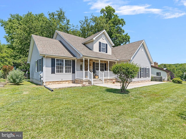 5185 Turkey Point Road, North East, MD 21901 - new england style home with covered porch, roof with shingles, a front lawn, and stone siding