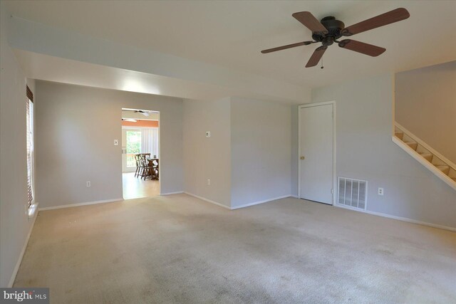 6483 Heatherfield Way, Harrisburg, PA 17112 - empty room with light colored carpet, a ceiling fan, stairs, and baseboards
