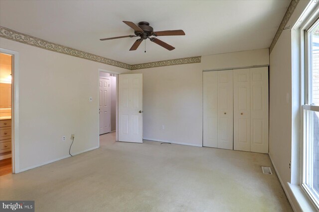 6483 Heatherfield Way, Harrisburg, PA 17112 - unfurnished bedroom with light colored carpet, a closet, baseboards, ensuite bathroom, and ceiling fan