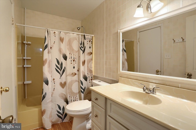 6483 Heatherfield Way, Harrisburg, PA 17112 - bathroom featuring tile walls, vanity, toilet, shower / bathtub combination with curtain, and wood finished floors