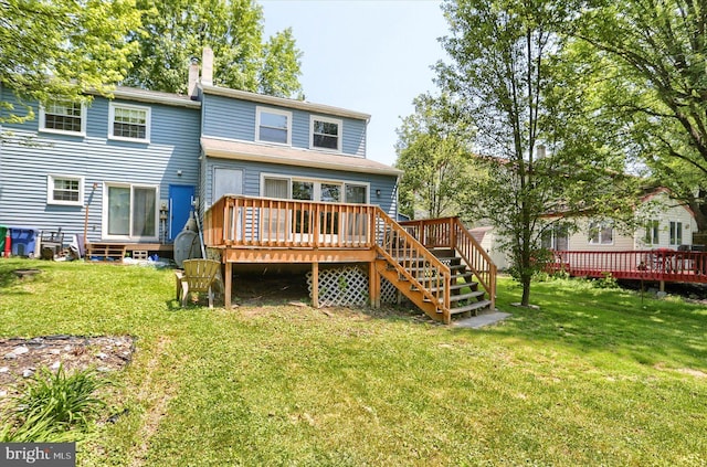 6483 Heatherfield Way, Harrisburg, PA 17112 - rear view of house featuring a wooden deck, a chimney, and a yard