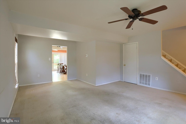 6483 Heatherfield Way, Harrisburg, PA 17112 - empty room with ceiling fan, light colored carpet, stairs, and baseboards