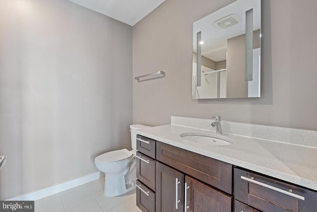 1320 Fenwick Ln Unit 201, Silver Spring, MD 20910 - bathroom with vanity, tile patterned flooring, toilet, an enclosed shower, and baseboards