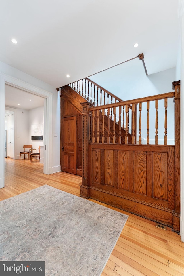 111 8th St SE, Washington, DC 20003 - staircase with wood finished floors, recessed lighting, and baseboards