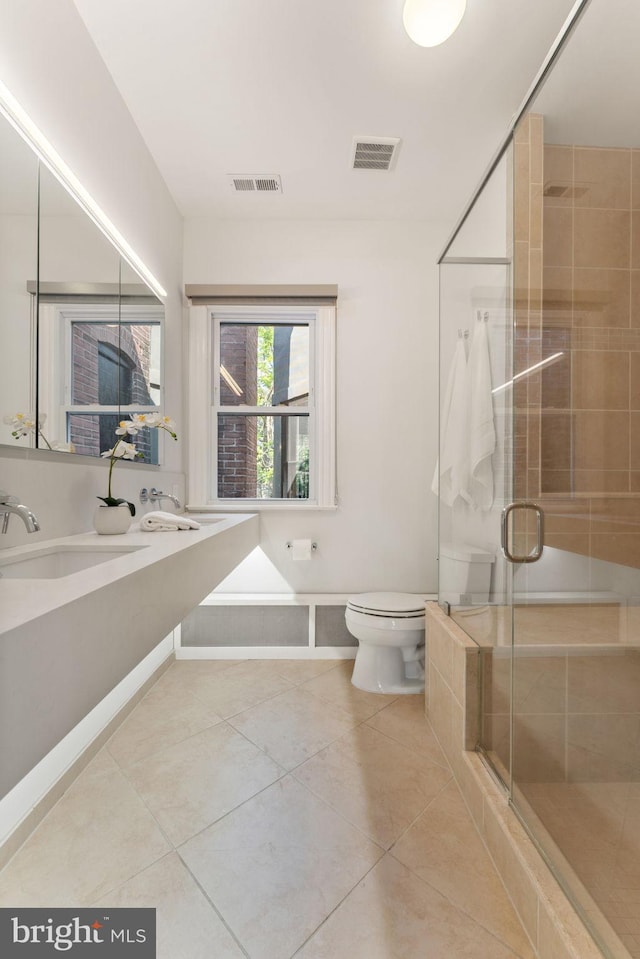 111 8th St SE, Washington, DC 20003 - bathroom featuring toilet, tile patterned flooring, a stall shower, and vanity