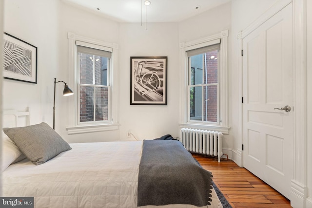 111 8th St SE, Washington, DC 20003 - bedroom featuring radiator and wood finished floors
