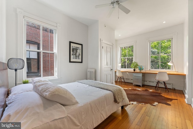 111 8th St SE, Washington, DC 20003 - bedroom with radiator heating unit, a baseboard radiator, wood-type flooring, recessed lighting, and a ceiling fan
