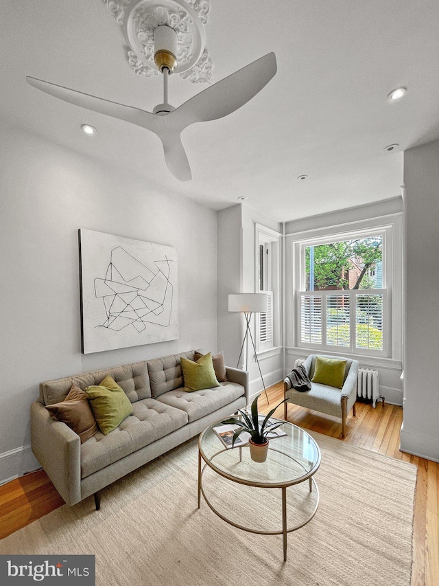 111 8th St SE, Washington, DC 20003 - living room featuring wood finished floors, baseboards, radiator, recessed lighting, and ceiling fan