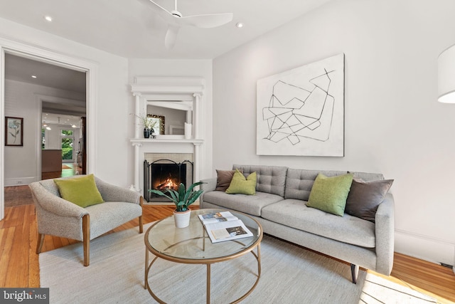 111 8th St SE, Washington, DC 20003 - living room with light wood-type flooring, a ceiling fan, a fireplace, and recessed lighting