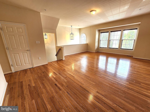 10361 Bridle Ct, Hagerstown, MD 21740 - unfurnished living room with hardwood / wood-style flooring and baseboards