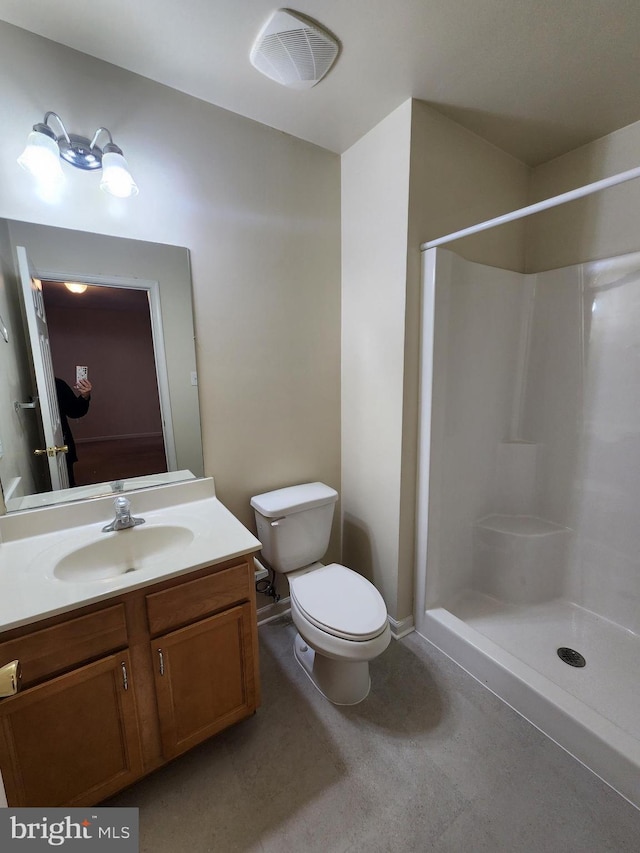 10361 Bridle Ct, Hagerstown, MD 21740 - bathroom featuring toilet, vanity, and a shower