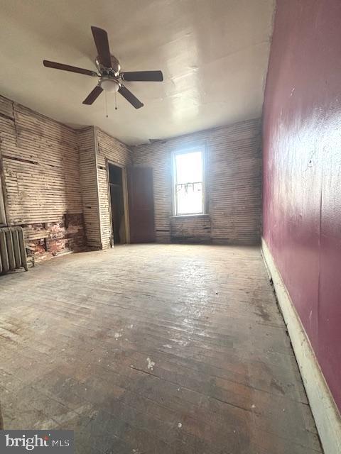 5328 Willows Ave, Philadelphia, PA 19143 - unfurnished living room with ceiling fan and hardwood / wood-style flooring