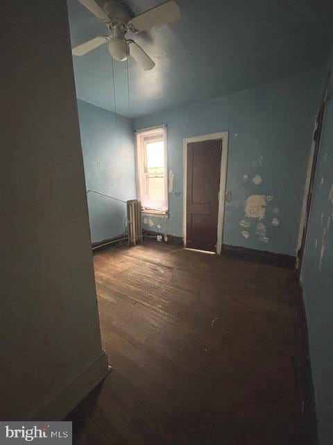 5328 Willows Ave, Philadelphia, PA 19143 - unfurnished room with dark wood-style floors, baseboards, and ceiling fan