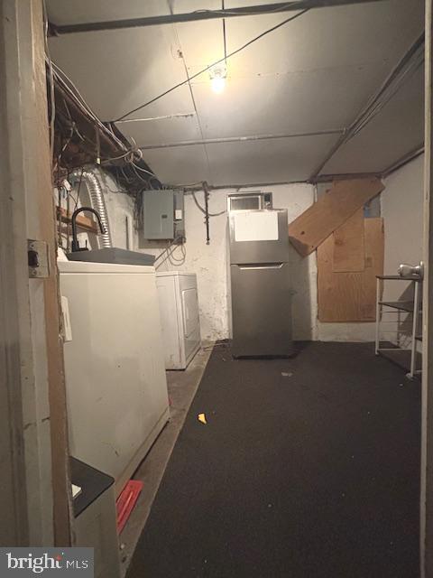 5328 Willows Ave, Philadelphia, PA 19143 - unfinished below grade area featuring freestanding refrigerator, washer and dryer, and electric panel