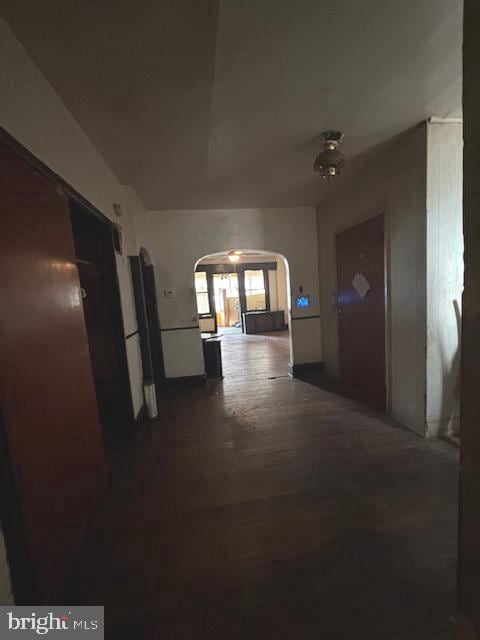 5328 Willows Ave, Philadelphia, PA 19143 - hall with arched walkways and dark wood-style floors