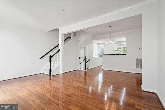 2706 Manhattan Pl, Vienna, VA 22180 - unfurnished living room featuring a chandelier, ornamental molding, wood finished floors, and stairway