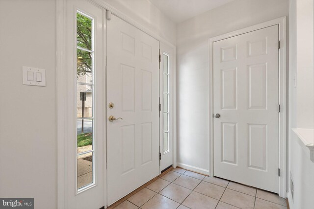2706 Manhattan Pl, Vienna, VA 22180 - foyer entrance with light tile patterned floors and baseboards