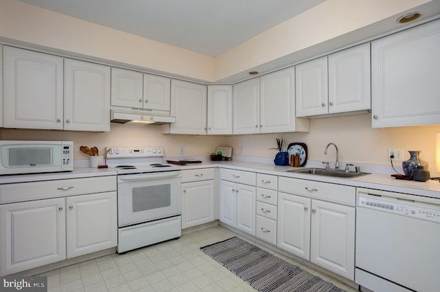 27 Stonehenge Cir Unit 27-11, Baltimore, MD 21208 - kitchen with white appliances, under cabinet range hood, a sink, and white cabinetry