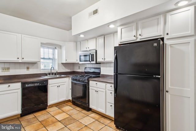 3305 Fleet St, Baltimore, MD 21224 - kitchen with black appliances, a sink, dark countertops, white cabinets, and recessed lighting