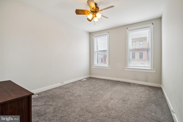 3305 Fleet St, Baltimore, MD 21224 - carpeted empty room featuring ceiling fan and baseboards