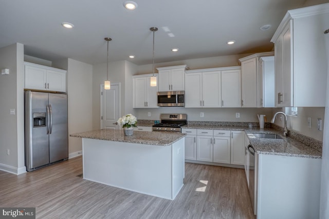 35141 Wright Way, Millsboro, DE 19966 - kitchen featuring appliances with stainless steel finishes, a sink, light wood-style floors, white cabinets, and recessed lighting