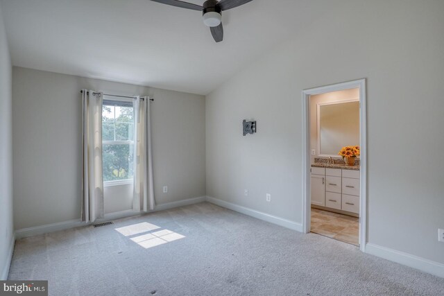 35141 Wright Way, Millsboro, DE 19966 - unfurnished bedroom with carpet floors, lofted ceiling, baseboards, connected bathroom, and a ceiling fan