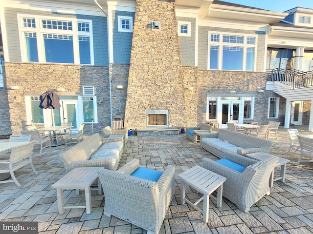 35141 Wright Way, Millsboro, DE 19966 - view of patio featuring french doors and an outdoor living space with a fireplace