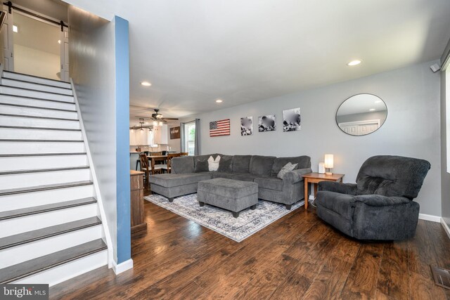 119 Truro St, Browns Mills, NJ 08015 - living area with stairway, a barn door, dark wood-type flooring, recessed lighting, and baseboards