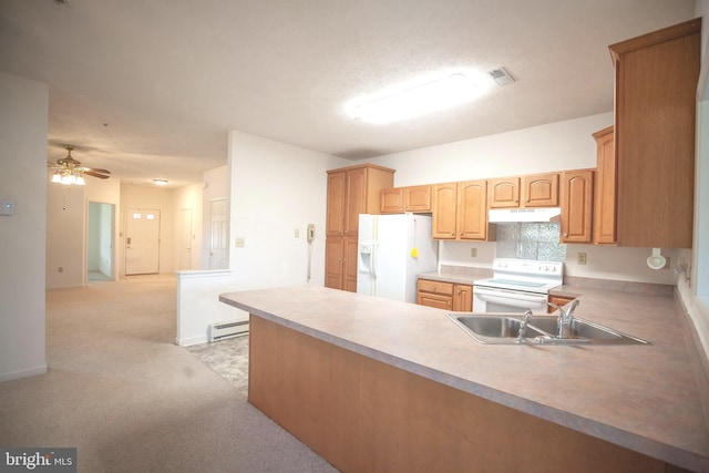 301 Sunbrook Ln Unit 89, Hagerstown, MD 21742 - kitchen with white appliances, under cabinet range hood, a baseboard heating unit, a sink, and a peninsula