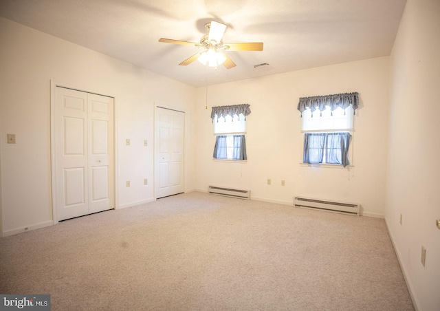 301 Sunbrook Ln Unit 89, Hagerstown, MD 21742 - unfurnished bedroom featuring a baseboard heating unit, multiple closets, carpet flooring, and baseboards