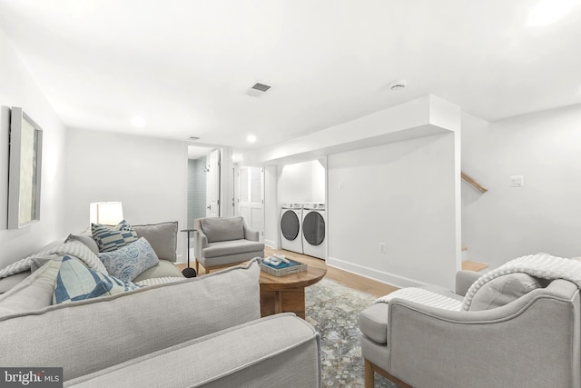 2402 E Randolph Ave, Alexandria, VA 22301 - living area with wood finished floors, stairway, independent washer and dryer, recessed lighting, and baseboards