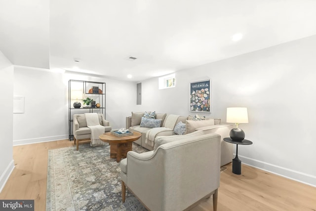 2402 E Randolph Ave, Alexandria, VA 22301 - living room featuring baseboards, light wood-style flooring, electric panel, and recessed lighting
